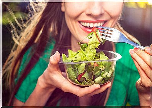 Woman eats salad to boost her immune system