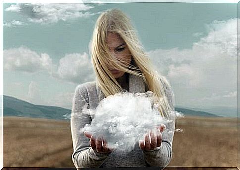 Woman holding a thundercloud that is the cause of all her problems as an example of self-deception