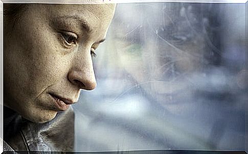 Woman Staring Out The Window Sad Because The Pain After Loss Is Severe
